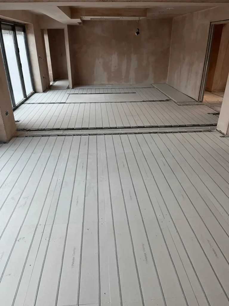 Underfloor heating pipework installed throughout a residential property